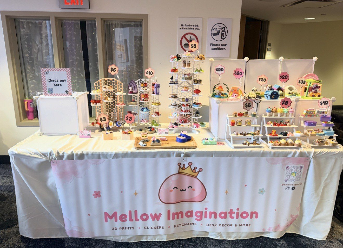 The Mellow Imagination table at a local Rochester market, full of colorful 3D-printed minis
